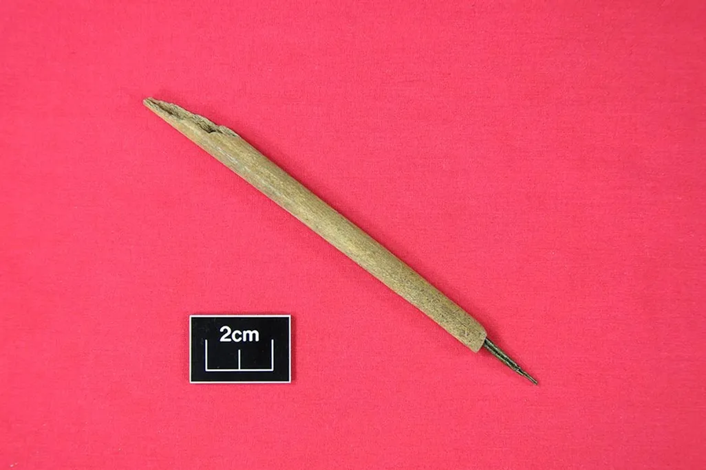 medieval ink pen made of bone and copper