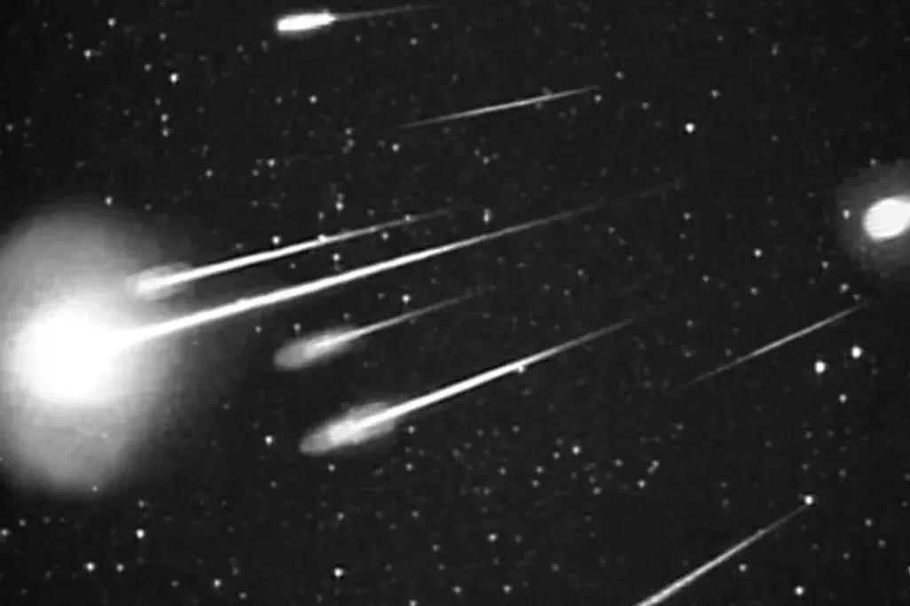 Photo of meteor shower against dark sky