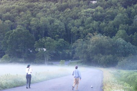 Drone with microphone and ecology students