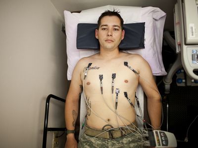 U.S. Army combat medic Shawn Aiken lies down during his EKG appointment at the VA Medical Center in El Paso, Texas May 24, 2013. Aiken, who served 16 months in Iraq and 13 months in Afghanistan and has been active duty for nearly 10 years, has severe post-traumatic stress disorder.