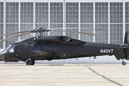 Half-breed: Piasecki Aircraft has taken a Sikorsky helicopter and bolted on airplane hardware — a propeller (ducted) and a fixed wing — hoping the resulting X-49A SpeedHawk (top) will bust through the constraints that have kept helicopters slow.