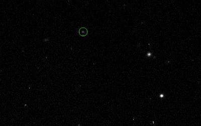 Astronomers traced 2011 QF99, circled in green, across the sky to find that it shared an orbit with Uranus.