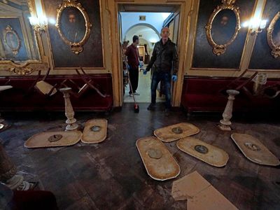 Upturned chairs and unmounted table tops lie on the floor inside the historic Caffe Florian, in San Marco square, in Venice, Italy, on Tuesday.