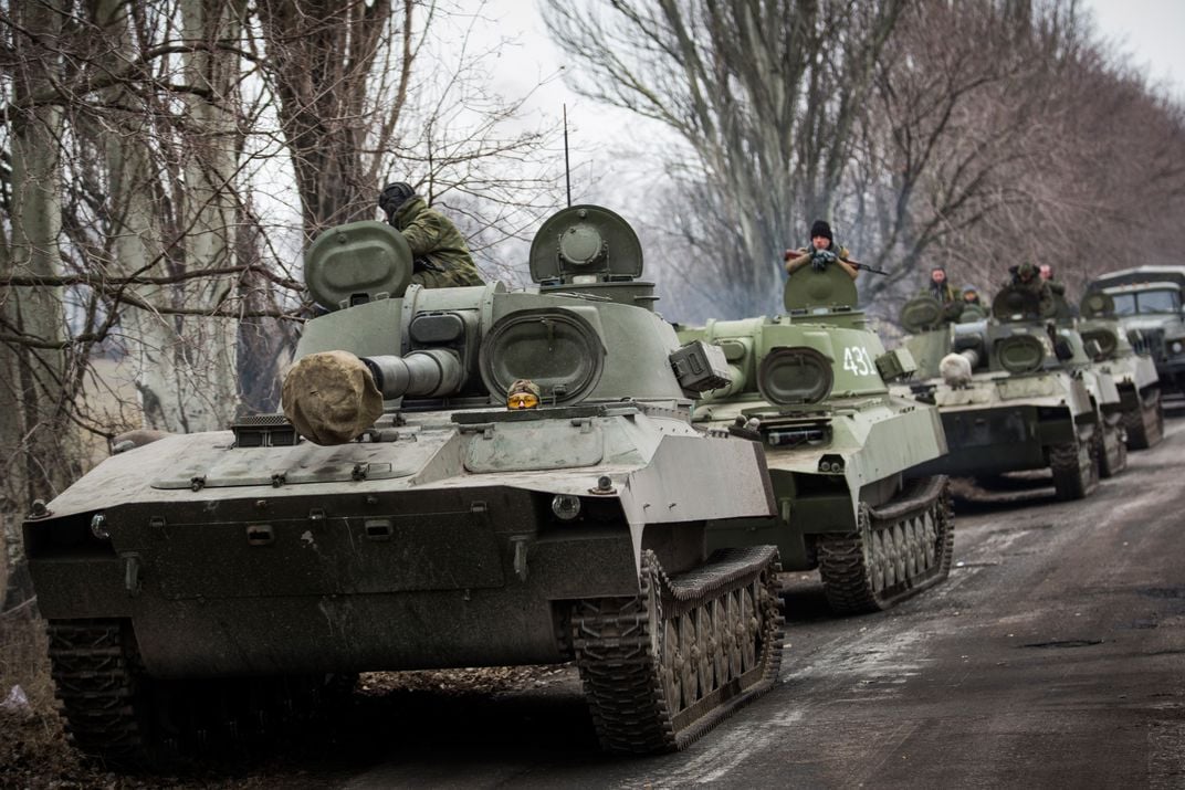Pro-Russian rebels allegedly move tanks and heavy weaponry away from the front line of fighting in accordance with the Minsk II agreement on February 26, 2015, in Chervonoe, Ukraine.