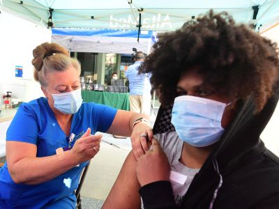 A nurse administers the Pfizer Covid-19 vaccine in Los Angeles, California, in August. More than one million individuals have gotten a third dose of the Pfizer or Moderna vaccine in the United States.