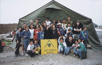 Norwegian troops (in rearmost rank) took over sponsorship of the First Kosovar Scouts, local school-age kids, when the Canadians returned home.