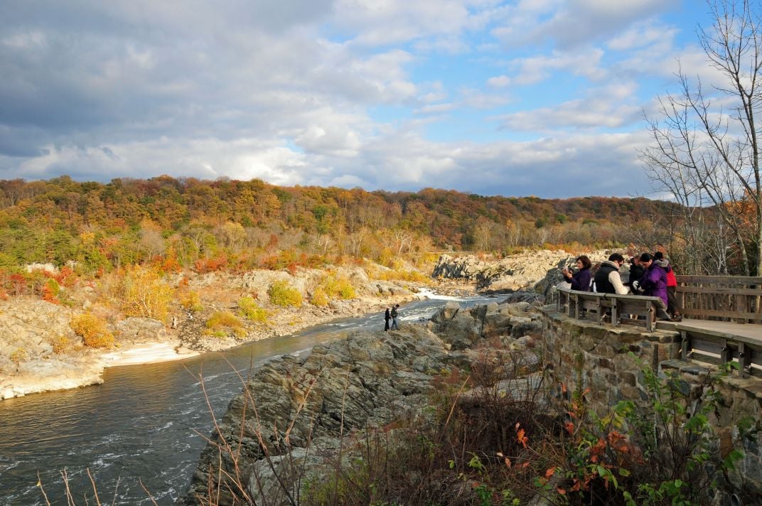 Many Photographers And Their Families Come To Great Falls National Park To Take Pictures Of The Beautiful Scenery Many People Come From Far Away And Everyone Has A Camera The Young Couple On