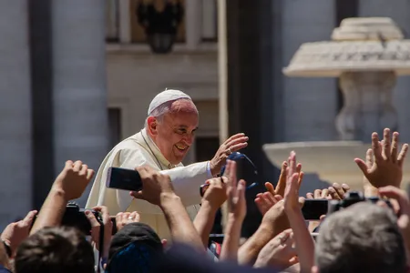 Pope Francis greets crowds in St. Peter's Square in 2014.
