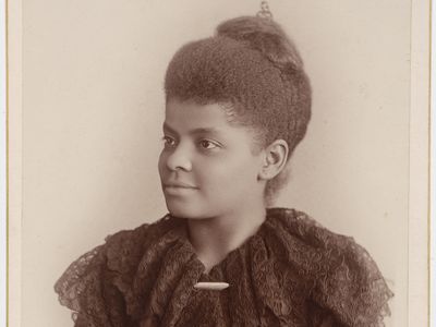 Portrait of Ida B. Wells from the waist up in 3/4th profile.