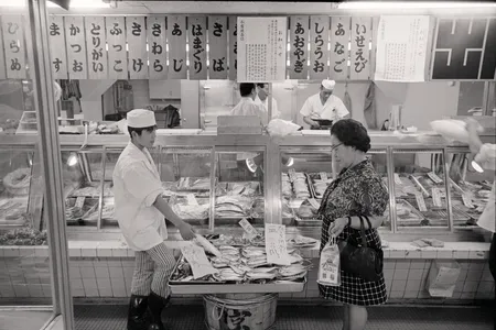 Archival image, July 9, 1973: (Original caption) A woman seems hesitant about buying fish at a shop in Tokyo recently (June 25) after the Japanese Health and Welfare Ministry's June 24th warning that no one should eat more than 567 grams (about one pound four ounces) of fish a week to avoid the possibility of dangerous mercury poisoning.