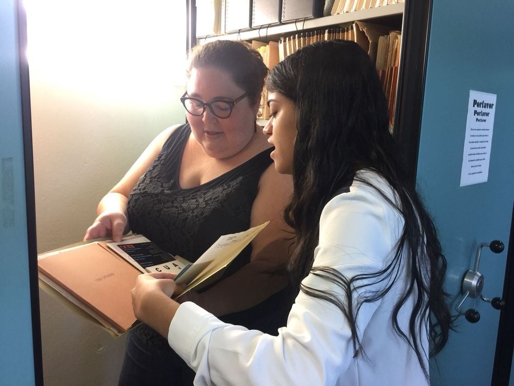 Amanda learning about documents used to create exhibitions and serve as learning tools for the public. Courtesy of the Museo de Historia, Antropología y Arte.