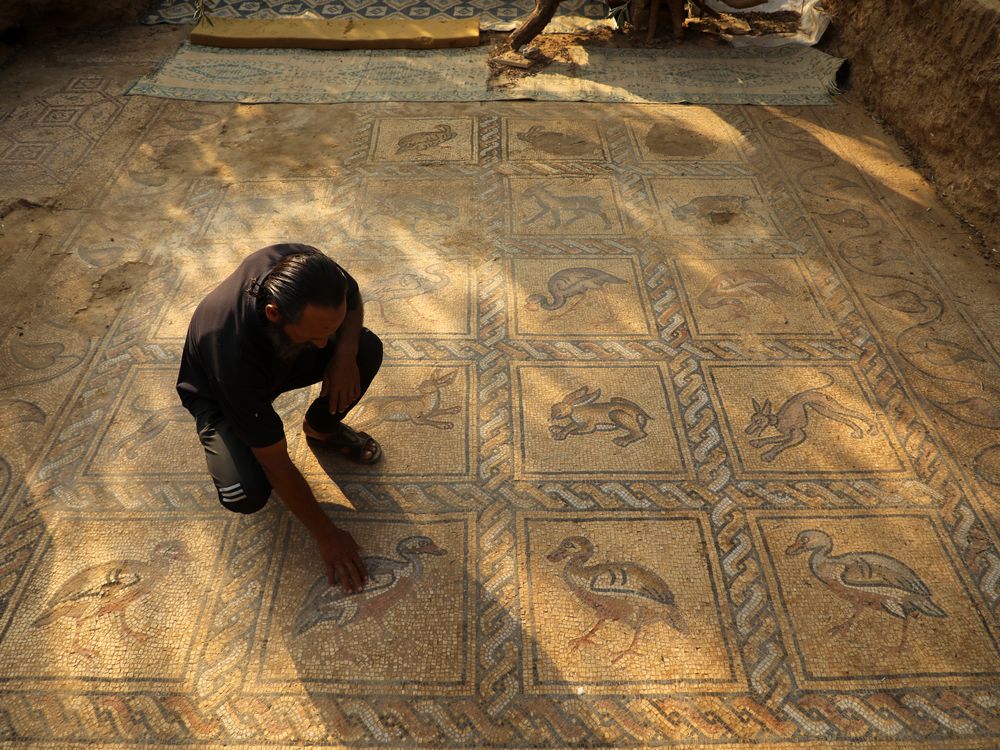 Farmer cleans mosaic
