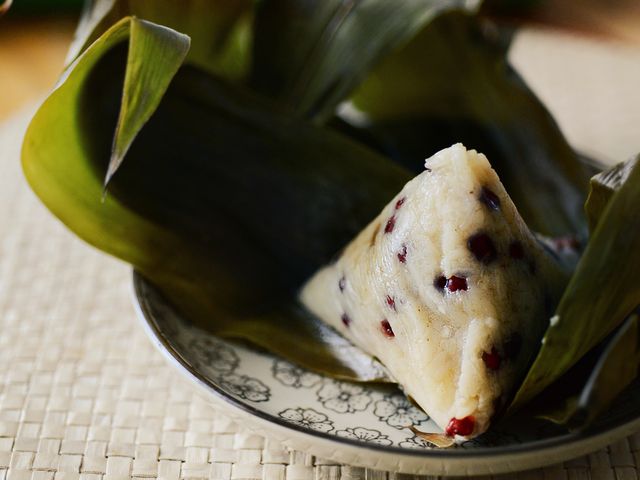 Zongzi are dumplings made from sticky glutinous rice wrapped neatly in a bamboo leaf and filled with umami-rich ingredients, like marinated pork, shiitake mushrooms, peanuts and beans.