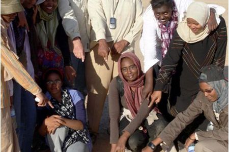 Muawia Shaddad of the University of Khartoum, Sudan and researcher Peter Jenniskens with students at the scene of a meteorite find in Sudan.