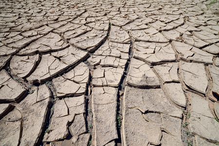 The ground cracks as a waterhole on Navajo lands in Arizona dries up.