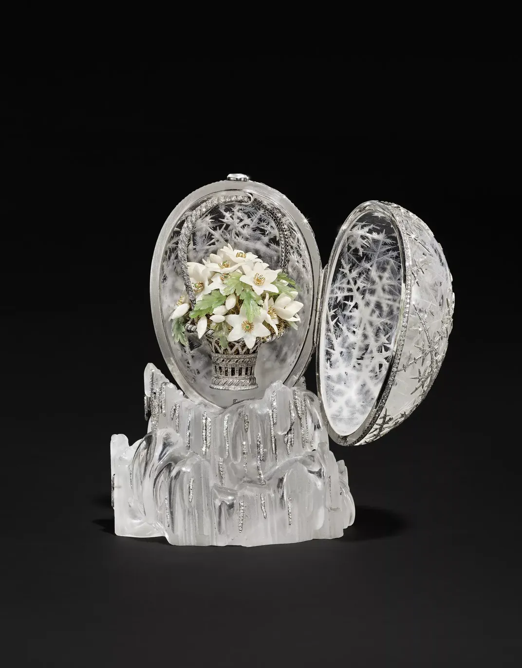 The Winter Egg holds a basket of white quartz flowers.