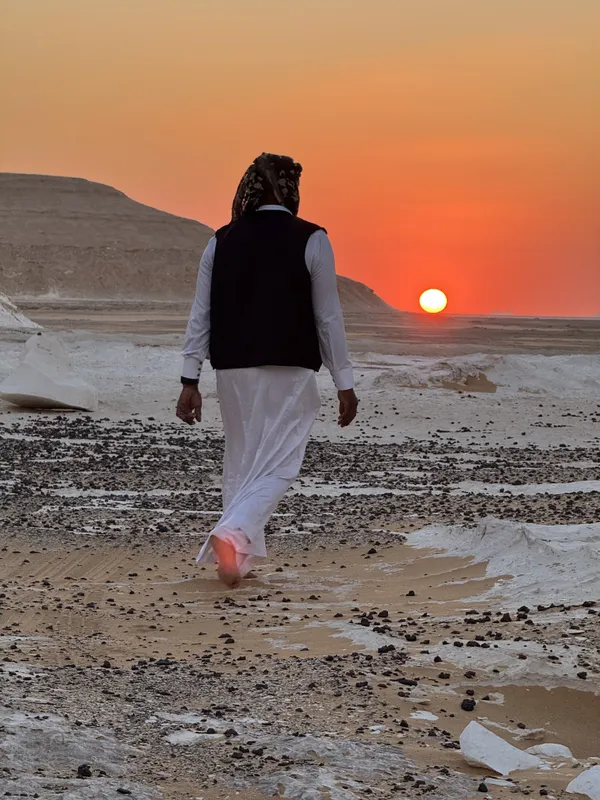 Barefoot Bedouin crossing the White Desert in Egypt thumbnail