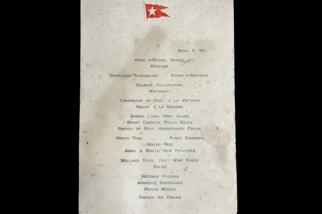 Piece of white paper with smudges and a red flag at the top