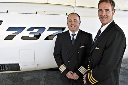 Captain Mark Nel (left, with First Officer Hugo van den Berg) insisted the crew wear full uniform during the air race.