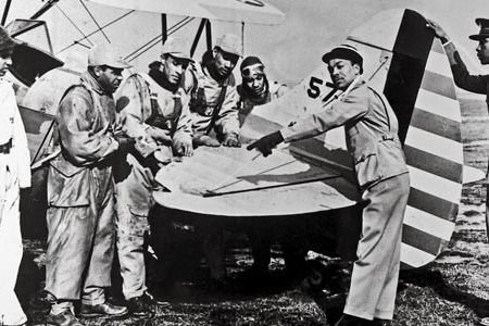 During wartime flight instruction at Harlem, students learned on a WACO UPF-7 trainer; the field also had Piper Cubs.