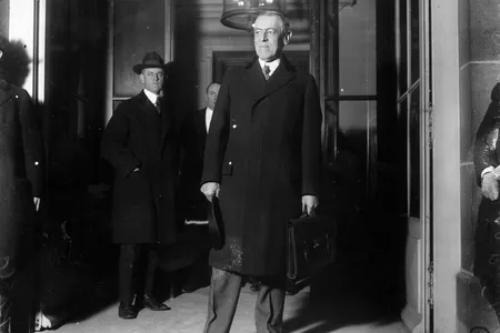 Woodrow Wilson, seen here at the start of the Paris Peace Conference in January 1919, never publicly acknowledged the pandemic's toll on his country.