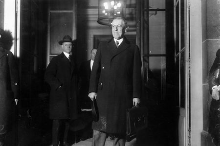 Woodrow Wilson, seen here at the start of the Paris Peace Conference in January 1919, never publicly acknowledged the pandemic's toll on his country.