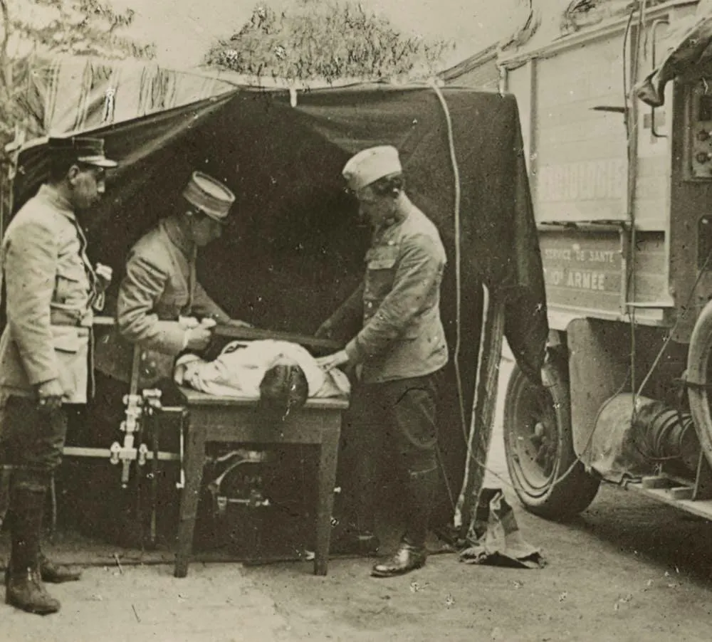 Medics at a French WWI field hospital locating a bullet with X-ray machine