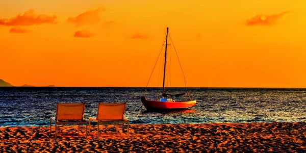 The Painted Pony Sailboat and Two Chairs at Sunset thumbnail