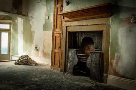 The Bront&euml; children were born near this fireplace, pictured mid-renovation.