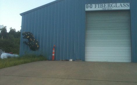A Tyrannosaurus busting out of a fiberglass shop near Hindsville, Arkansas