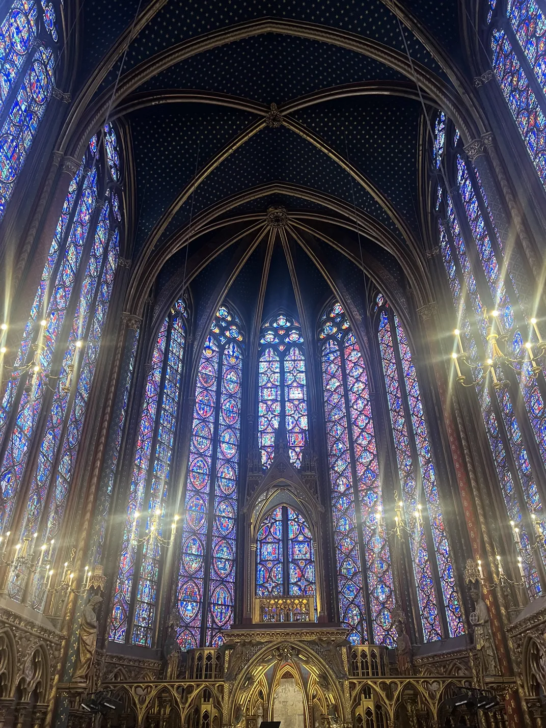10 - Light shines through the stained glass windows of Sainte-Chapelle in Paris.