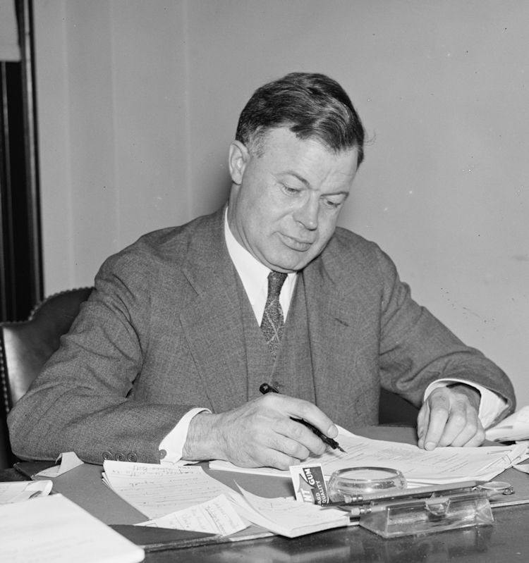 J. Warren Madden, the first chairman of the National Labor Relations Board, working at his desk in June 1937