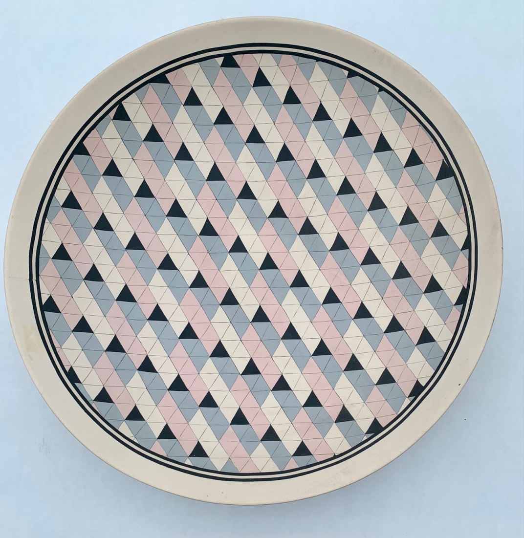 Ceramic plate with quilt motif.