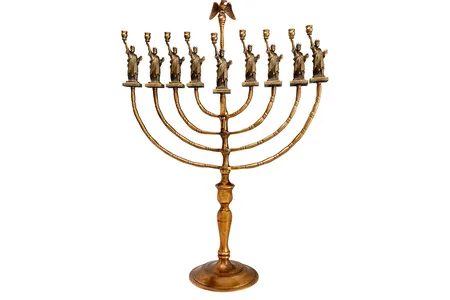 Many immigrants sought to preserve their cultural heritage while at the same time embracing their new identity as Americans. Manfred Anson did so in designing this Hanukkah lamp to mark the centennial of the Statue of Liberty in 1986.&nbsp;