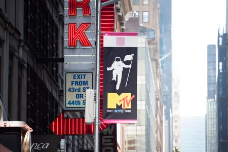 A flag in New York City's Times Square marks MTV's 40th birthday.