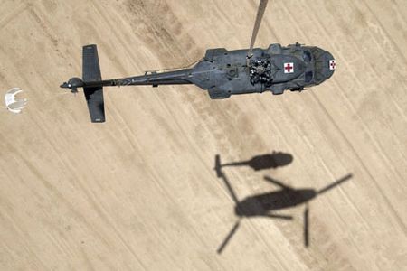 One helicopter helps another in Iraq.