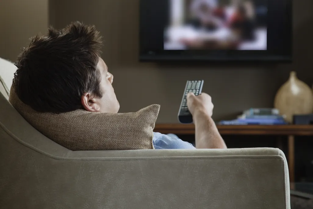 man watching television