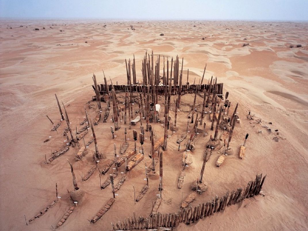 Desert cemetery with boats and oars