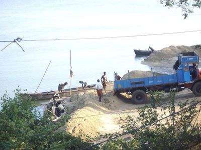 Sand Mining on the banks of the Sita River near Mabukala bridge in Brahmavar, India