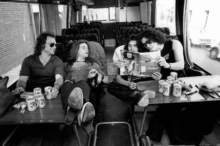 L to R: Michael Anthony, David Lee Roth, Eddie Van Halen and Alex Van Halen pose on a tour bus in 1978.