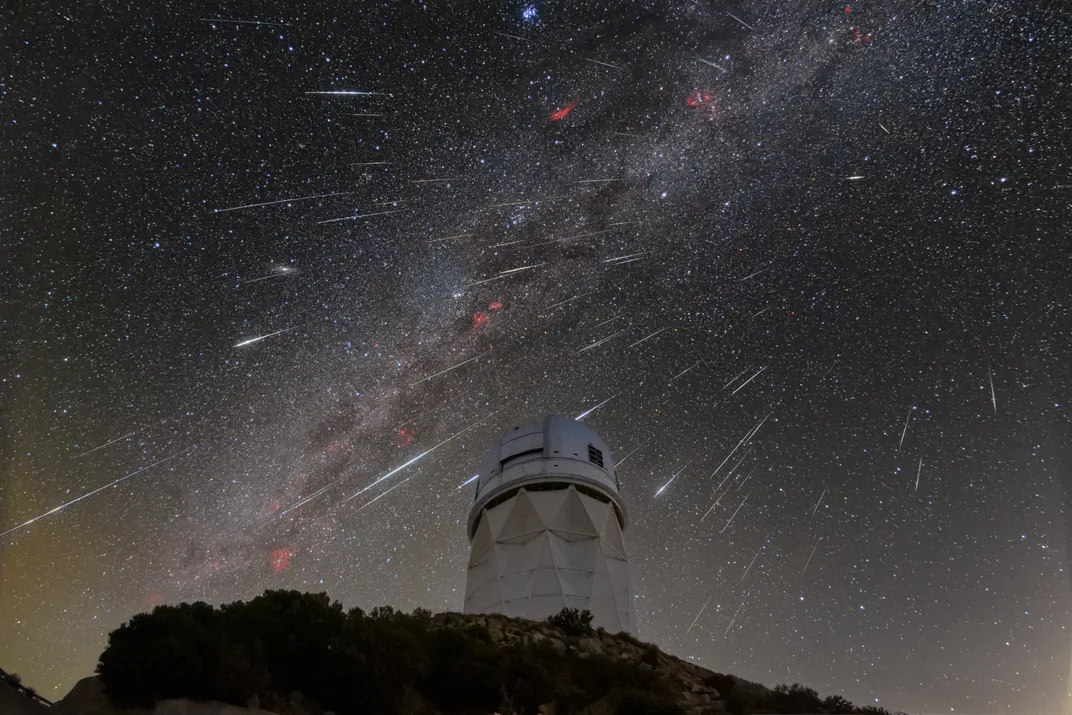meteors and the Milky Way are seen above the Kitt Peak National Observatory
