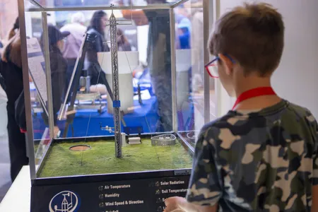 A young learner explores an exhibit at the 2024 National Weather Festival, hosted by the National Weather Center, which is located in Norman but unaffiliated with the National Weather Museum.