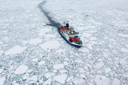 The research vessel Polarstern moves through Arctic sea ice.