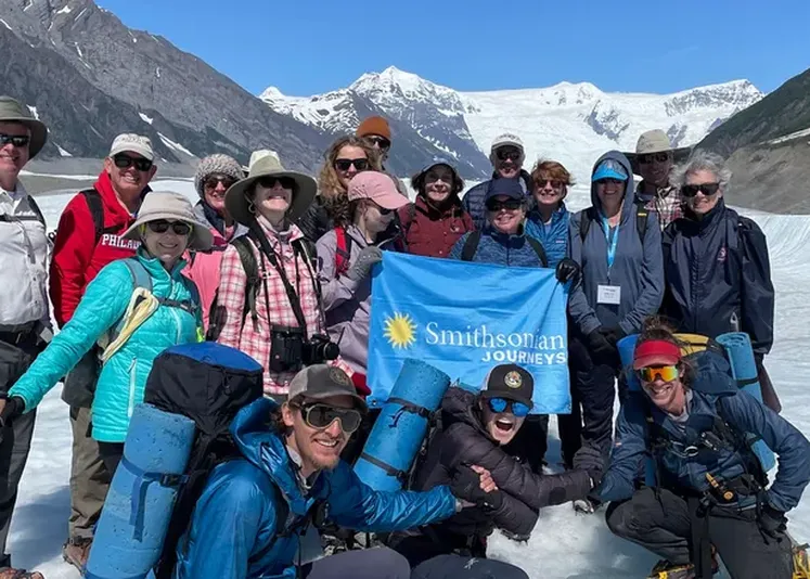 Smithsonian Journeys travelers on a glacier in Alaska. Credit: John Grabowska