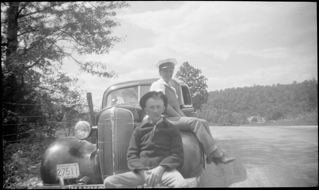A pair of cappers sit on a vehicle, circa 1940