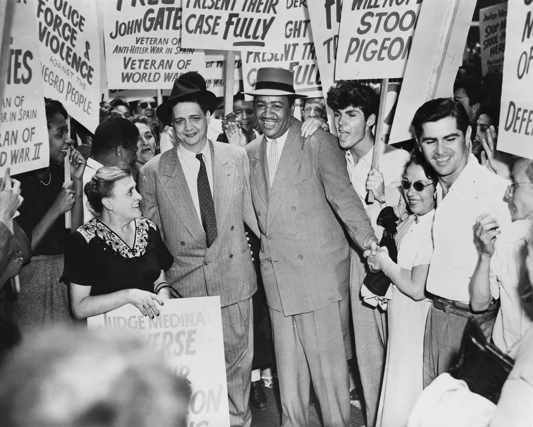 Robert Thompson and Benjamin Davis leaving a federal courthouse in New York City