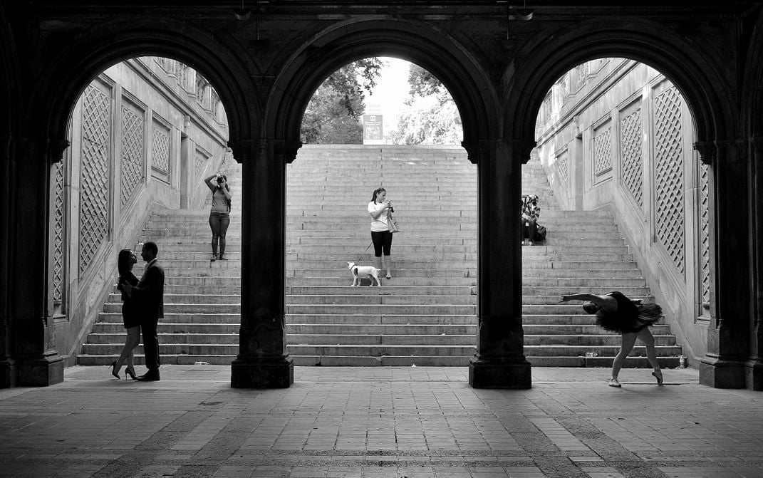 an arched staircase with walkers