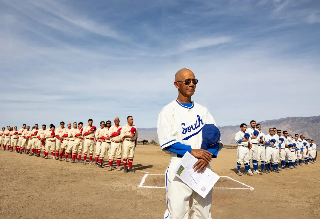 Dan Kwong with players in 1940s-style uniforms