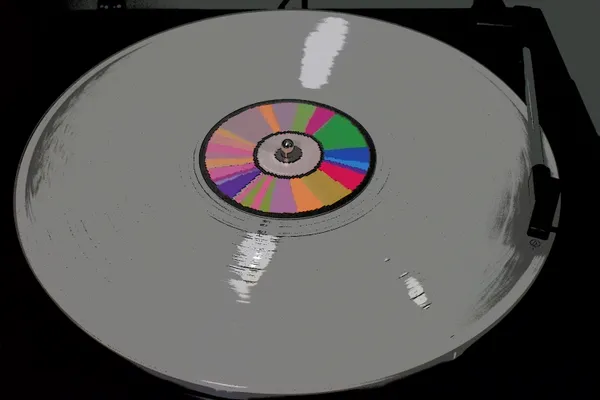 A vinyl spinning on a record player. thumbnail