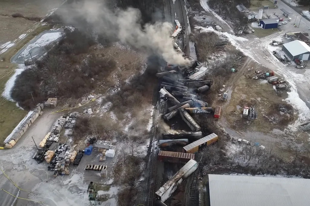 A video screenshot showing the site of the derailed train